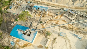 Aerial View Of A Building Construction Site With A Large Crane Shutterstock 2285931823