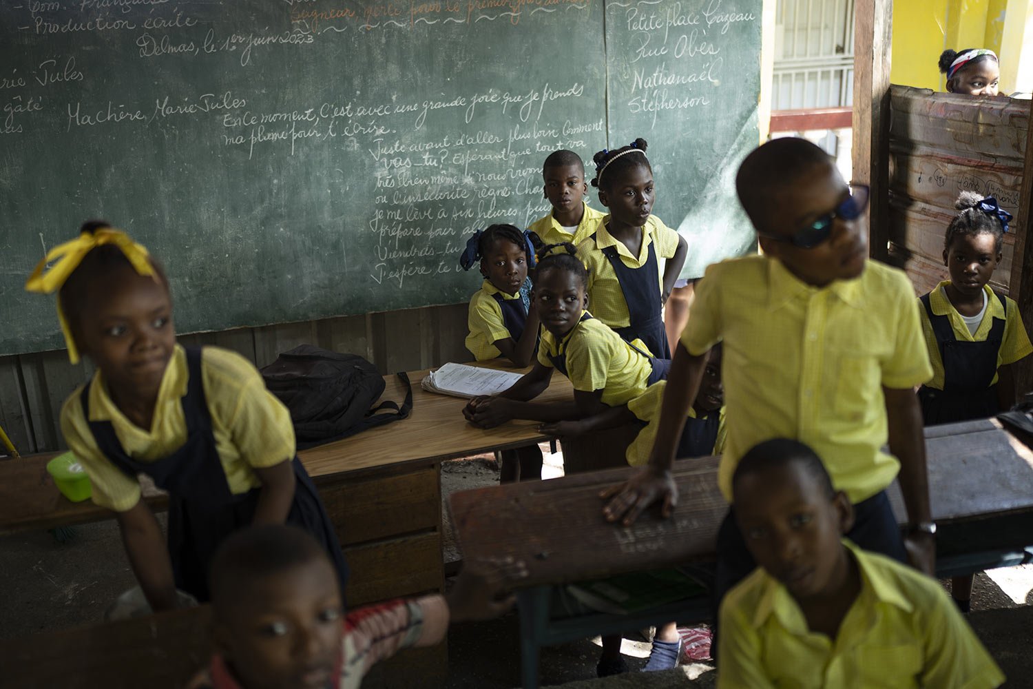  Students wait for their teacher to arrive at the Institution Mixte Wesleyenne Regard Divin school, in Port-au-Prince, Haiti, June 1, 2023. (AP Photo/Ariana Cubillos) 