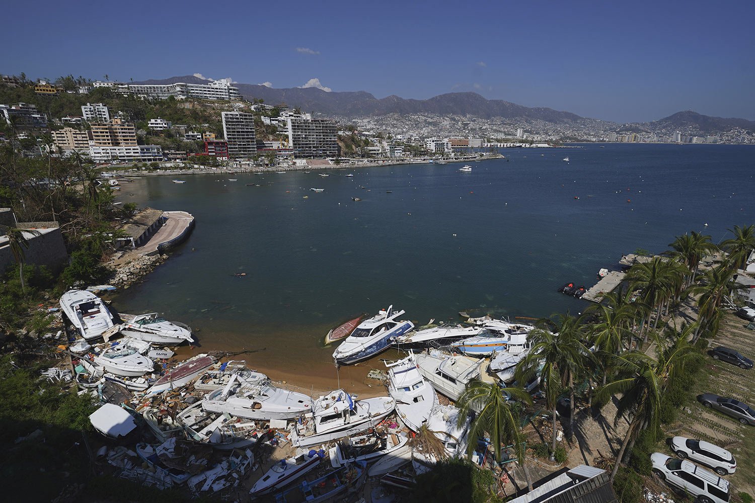  Docked yachts damaged by Hurricane Otis are scattered along the port in Acapulco, Mexico, Nov. 12, 2023. (AP Photo/Marco Ugarte) 