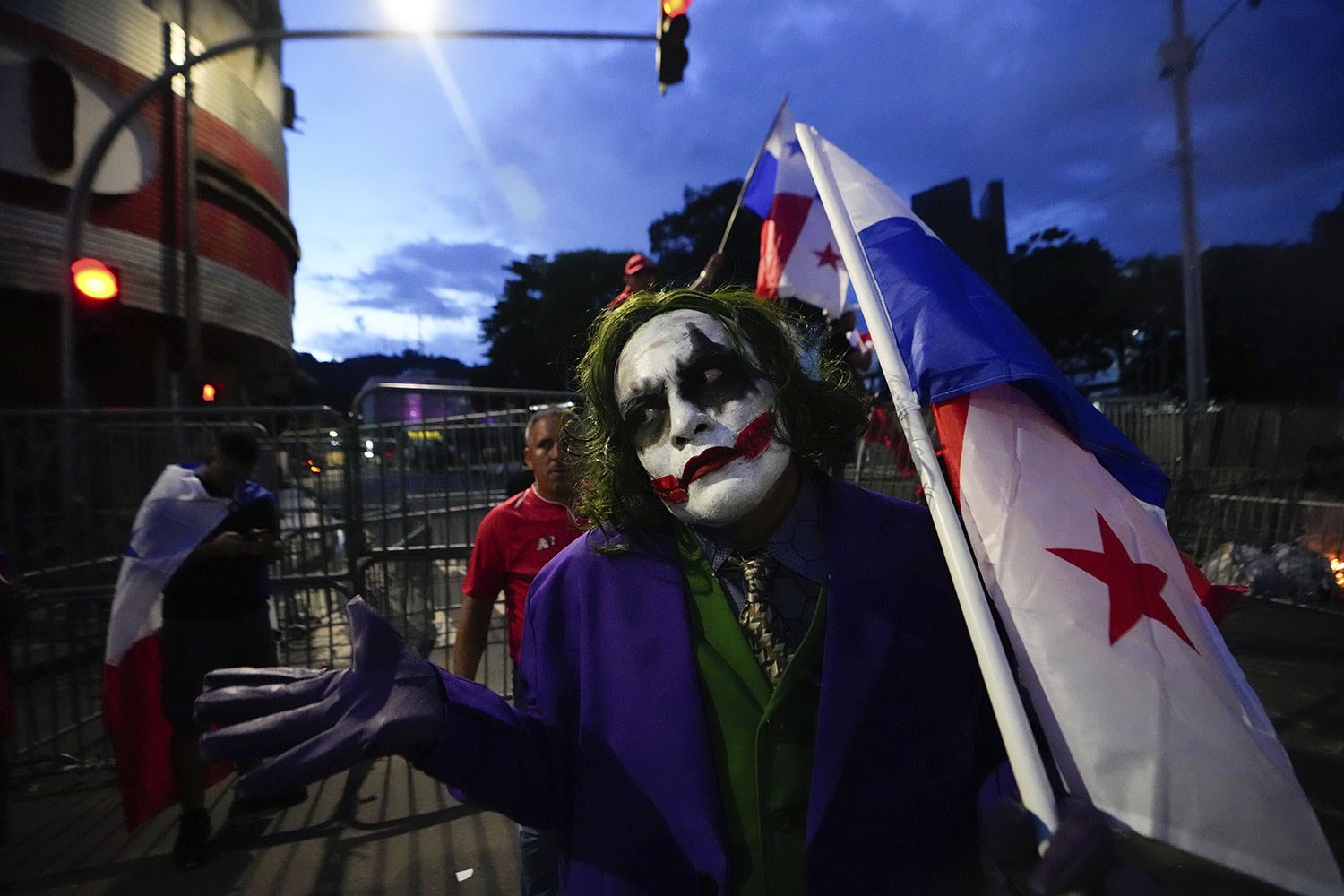  A demonstrator dressed as Batman villain, the Joker, holds a Panamanian national flag during a protest against an approved mining contract between the government and Canadian mining company First Quantum, in Panama City, Oct. 31, 2023.  Weeks later 