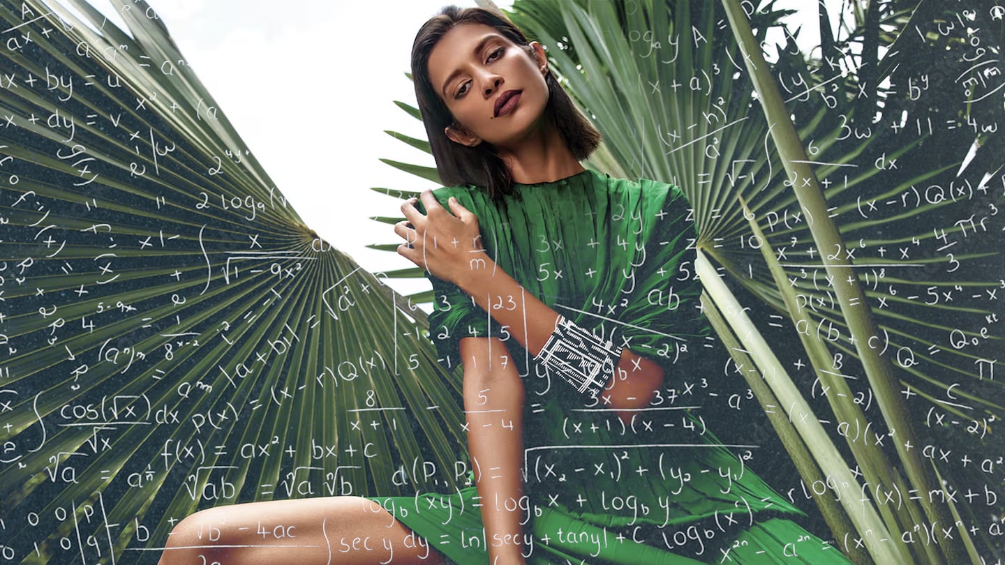 A woman in a green dress sits in front of palm fronds. She is surrounded by complicated equations.