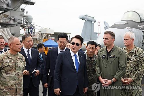 (LEAD) Yoon visits U.S. aircraft carrier ahead of trilateral drills with S. Korea, Japan