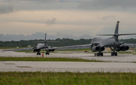 In this US Air Force image obtained from the US Defense Department, two US Air Force B-1B Lancers prepare to take off from Andersen Air Force Base, Guam to fly sequenced bilateral missions with two Japan Air Self-Defense Force (JASDF) F-15s and two Republic of Korea air force (ROKAF) F-15Ks in the vicinity of the Sea of Japan, on October 10, 2017. The US flies two supersonic heavy bombers over the Korean peninsula in a fresh show of force against North Korea's nuclear and missile threats. (Photo by Joshua SMOOT / US AIR FORCE / AFP) / RESTRICTED TO EDITORIAL USE - MANDATORY CREDIT 
