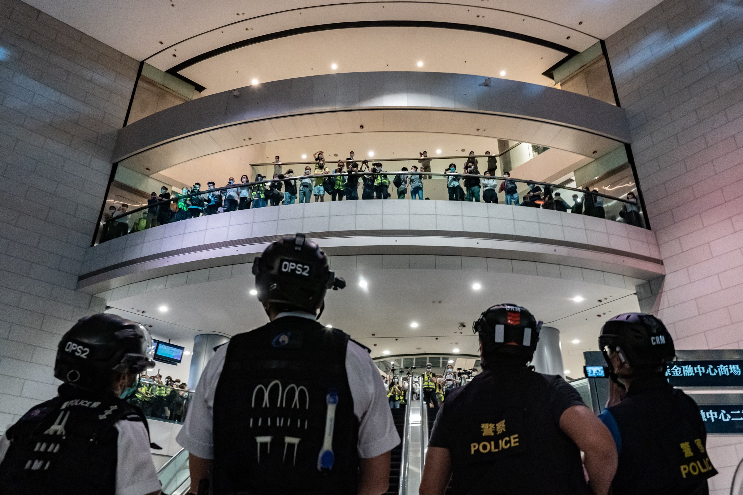 Police stand off with protesters at the International Finance Center shopping mall on April 28, 2020, in Hong Kong.