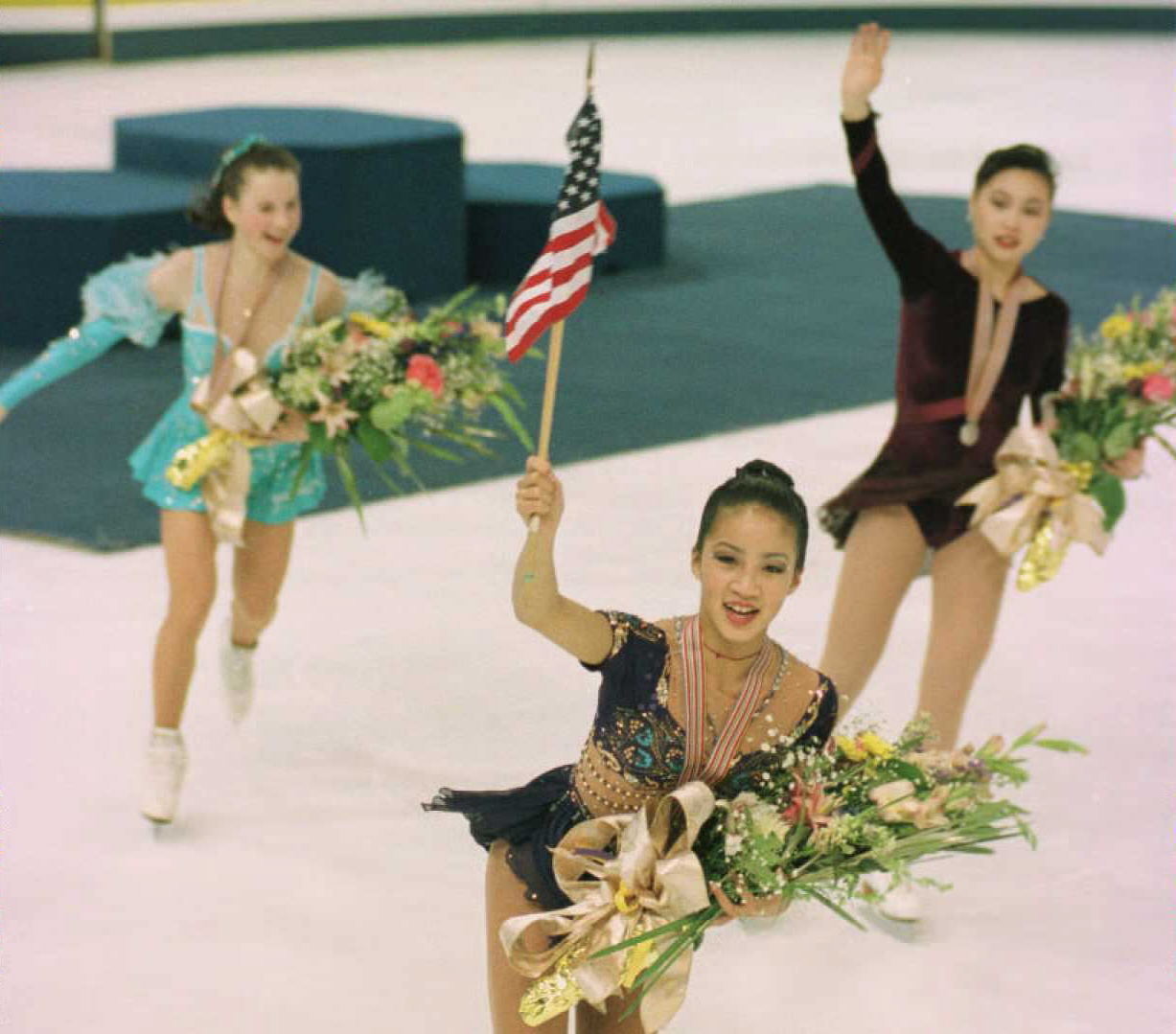 Michelle Kwan leads the podium in 1996, her first of what would be five World Championship titles.
