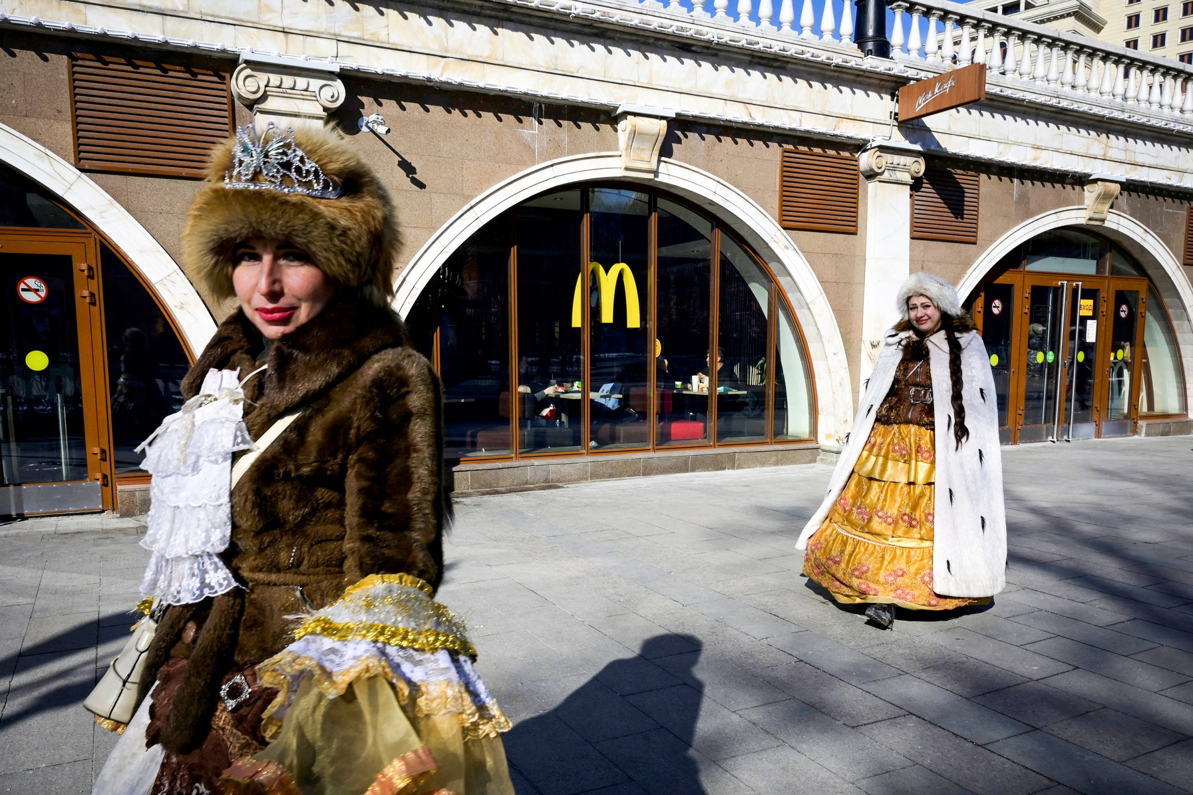 Women walk in front of a McDonald’s restaurant in central Moscow on March 9, 2022.
