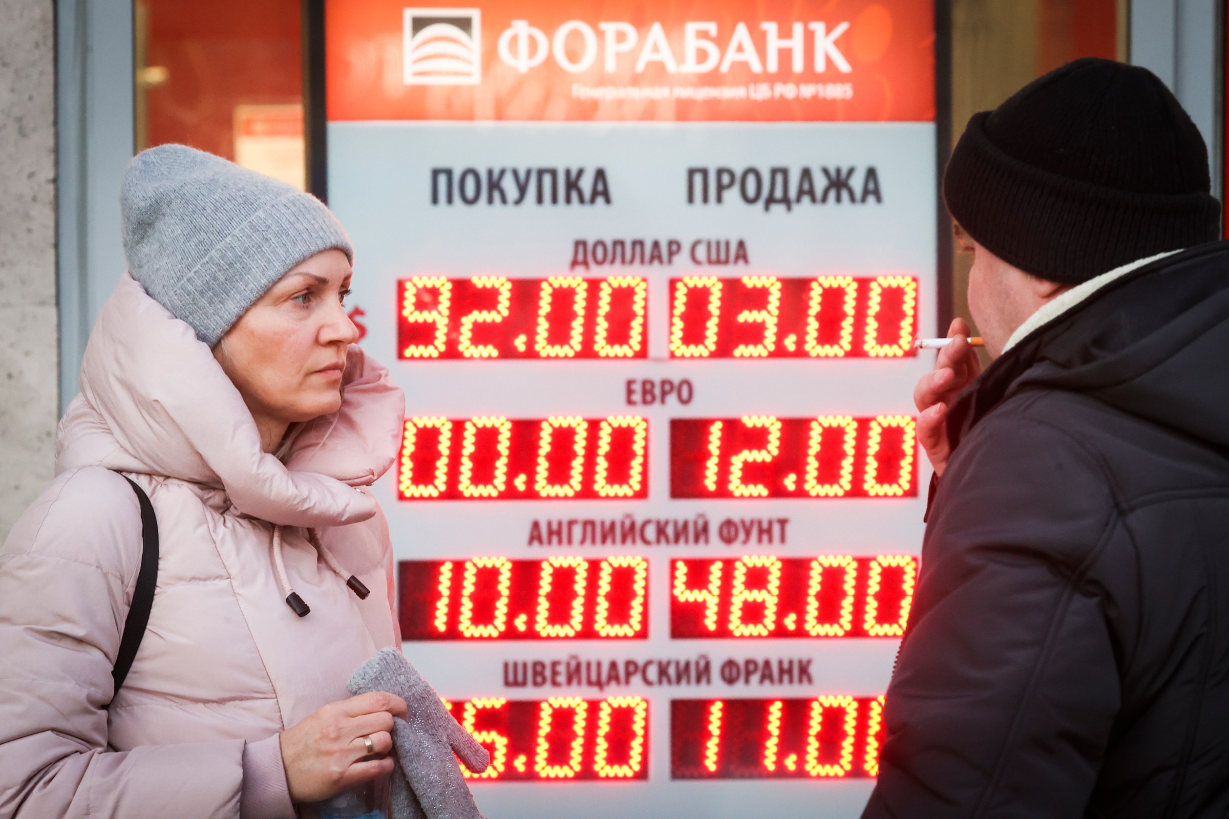 A currency exchange information board in Moscow on March 1. JPMorgan estimates that Russia’s economy will shrink 35 percent in the second quarter of 2022 and 7 percent for the entire year.