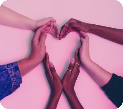 This is an image of hands for a variety of people from different races, forming a heart