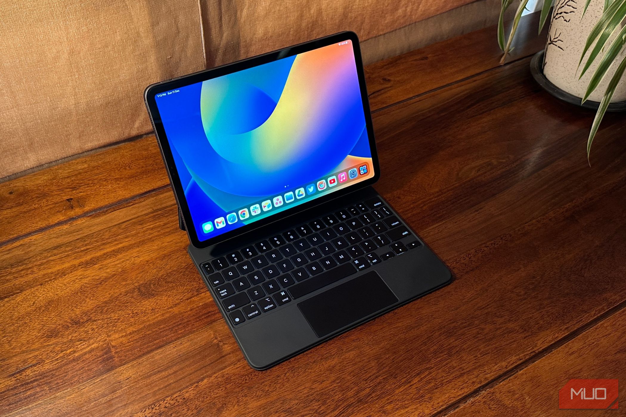 iPad Pro docked into Magic Keyboard case placed on a table
