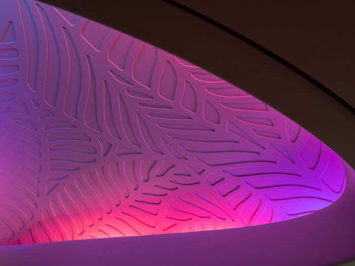 The patterns chosen for the seats, flooring, and ceilings have shades of blue and purple, Hawaiian Airlines