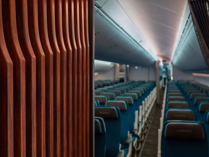 The main cabin has 266 Collins Aerospace Aspire seats with ergonomically contoured back and armrests.