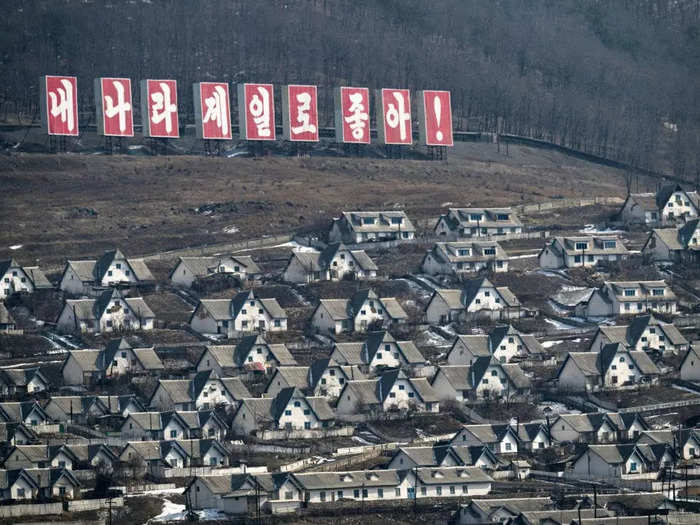 A sign on a hillside in the town of Chunggang reads: "My country is the best."