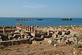 Remains of mole (background) and bath house (foreground) of the ancient harbour town of Apollonia, Libya
