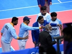 India players argue with a referee on a disputed decision in the men's kabaddi gold medal match between India and Iran during the Hangzhou 2022 Asian Games in Hangzhou, in China's eastern Zhejiang province(AFP)