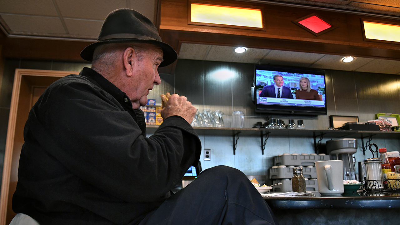 Jim Smith, a regular at Nazareth Diner in Nazareth, Pennsylvania, watches Fox News over breakfast. (Michael S. Williamson/The Washington Post via Getty Images)
