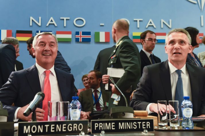 Đukanović, left, at a NATO foreign ministers meeting next to NATO Secretary-General Jens Stoltenberg | John Thys/AFP via Getty Images