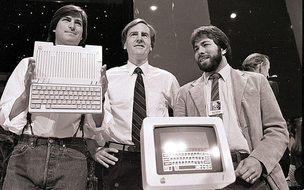 Jobs (L), president and chief executive John Sculley (C) and Wozniak (R) pictured in 1984
