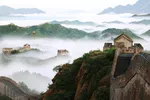 The Great Wall of China shrouded in fog.